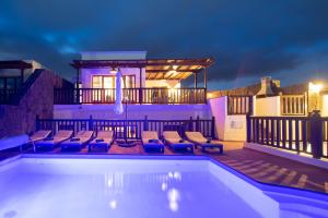 playa_blanca_villa_vista_rey_private_heated_pool_night