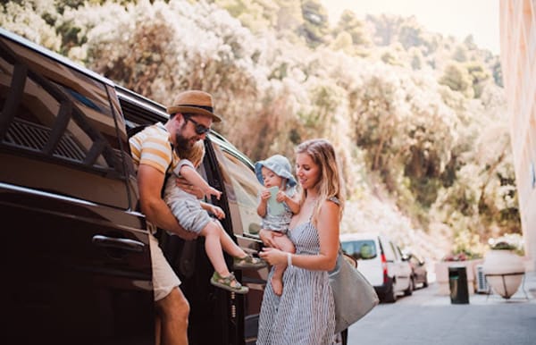 Family getting out of car